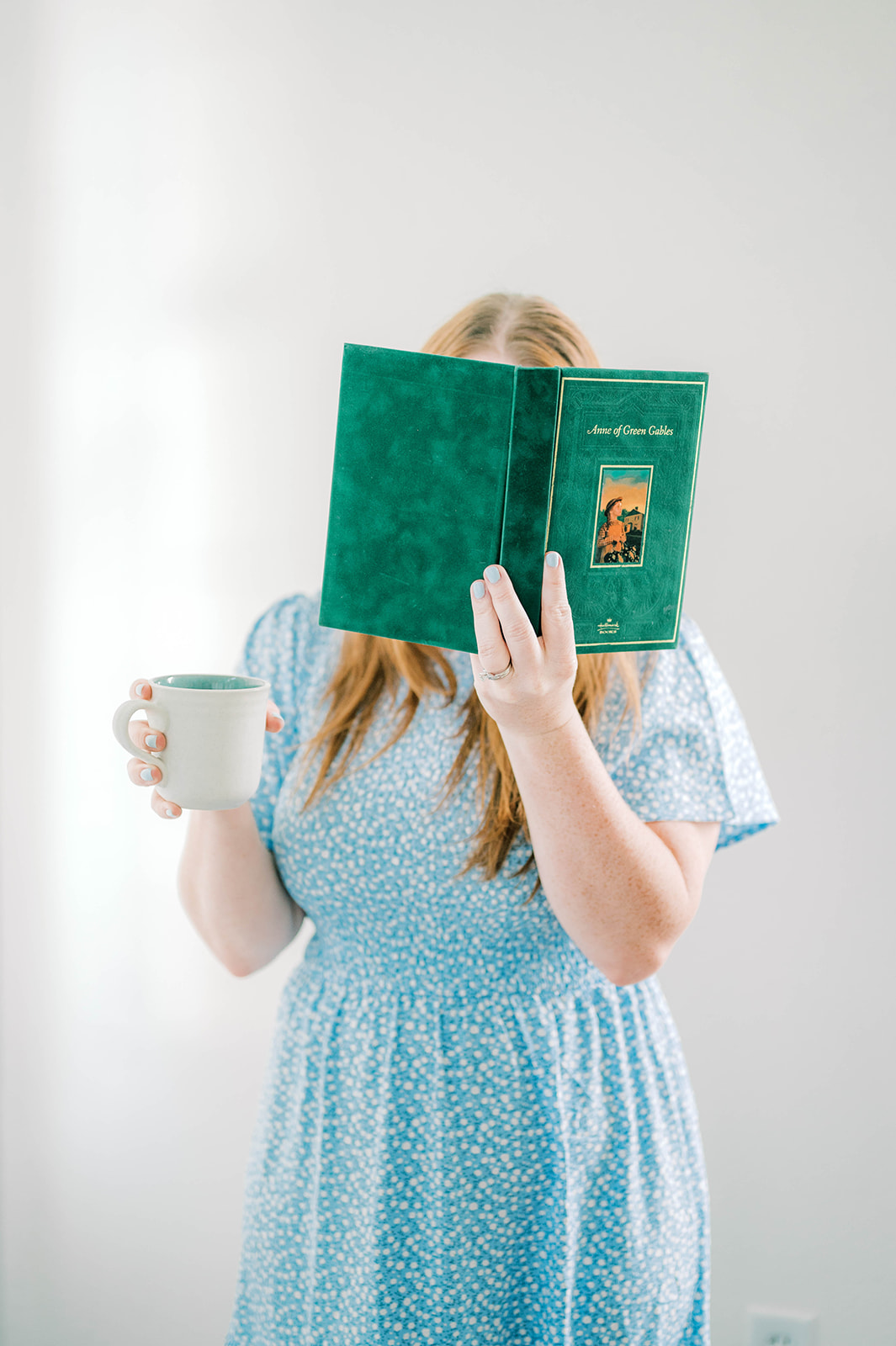 Anne of Green Gables Book being read with a cup of coffee